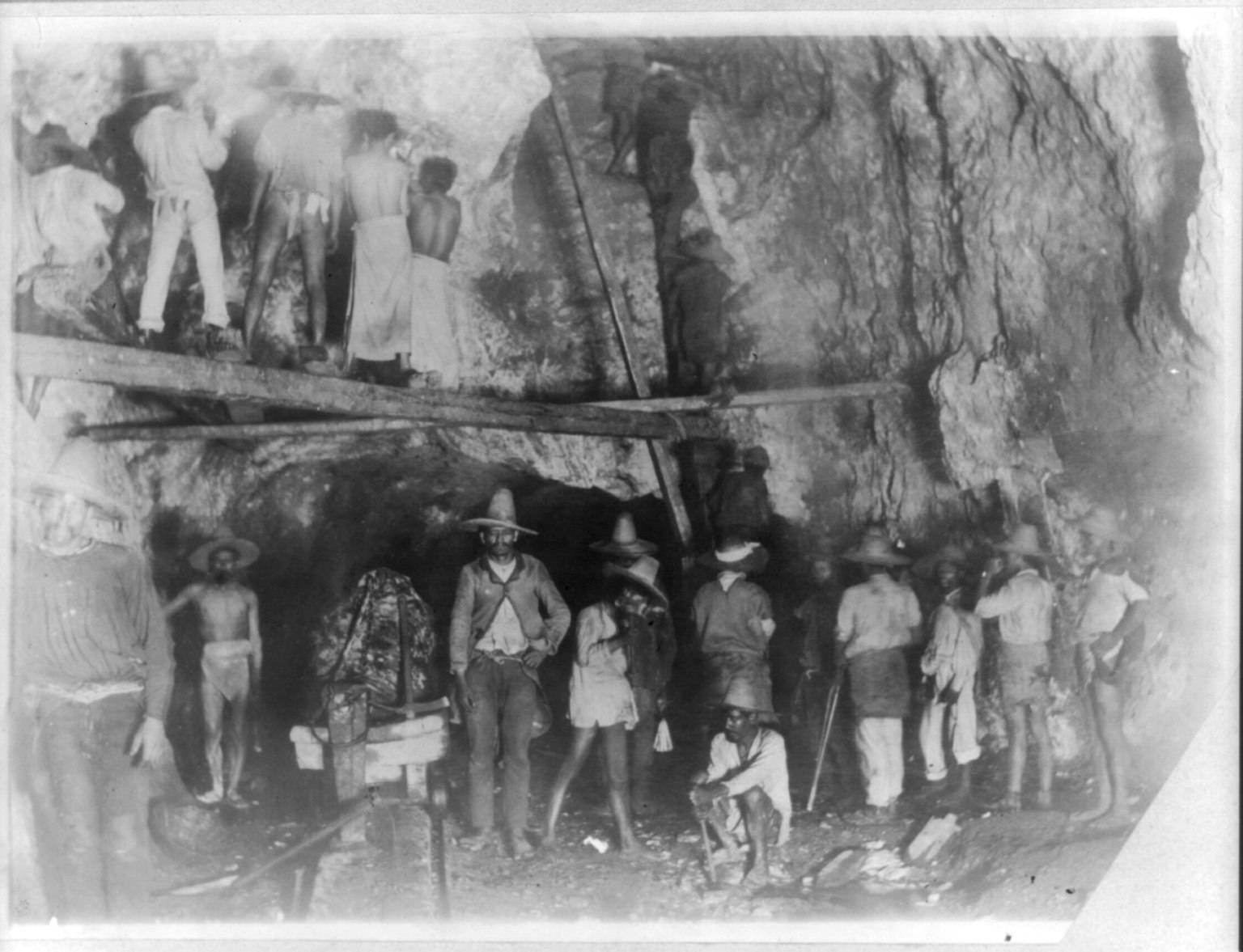 Old photograph of miners in 1890 in front of silver Mexican silver mine
