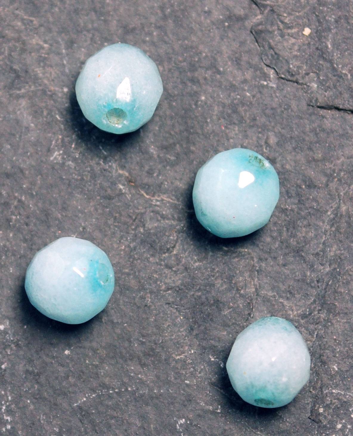 Chalcedony beads with darker dye showing around the bead holes