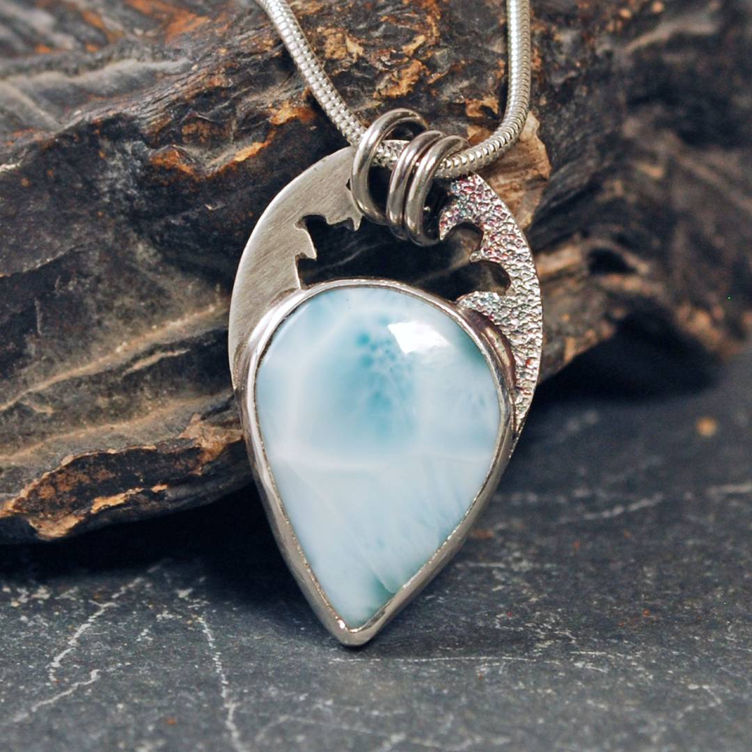 Larimar silver pendant with waves above the stone