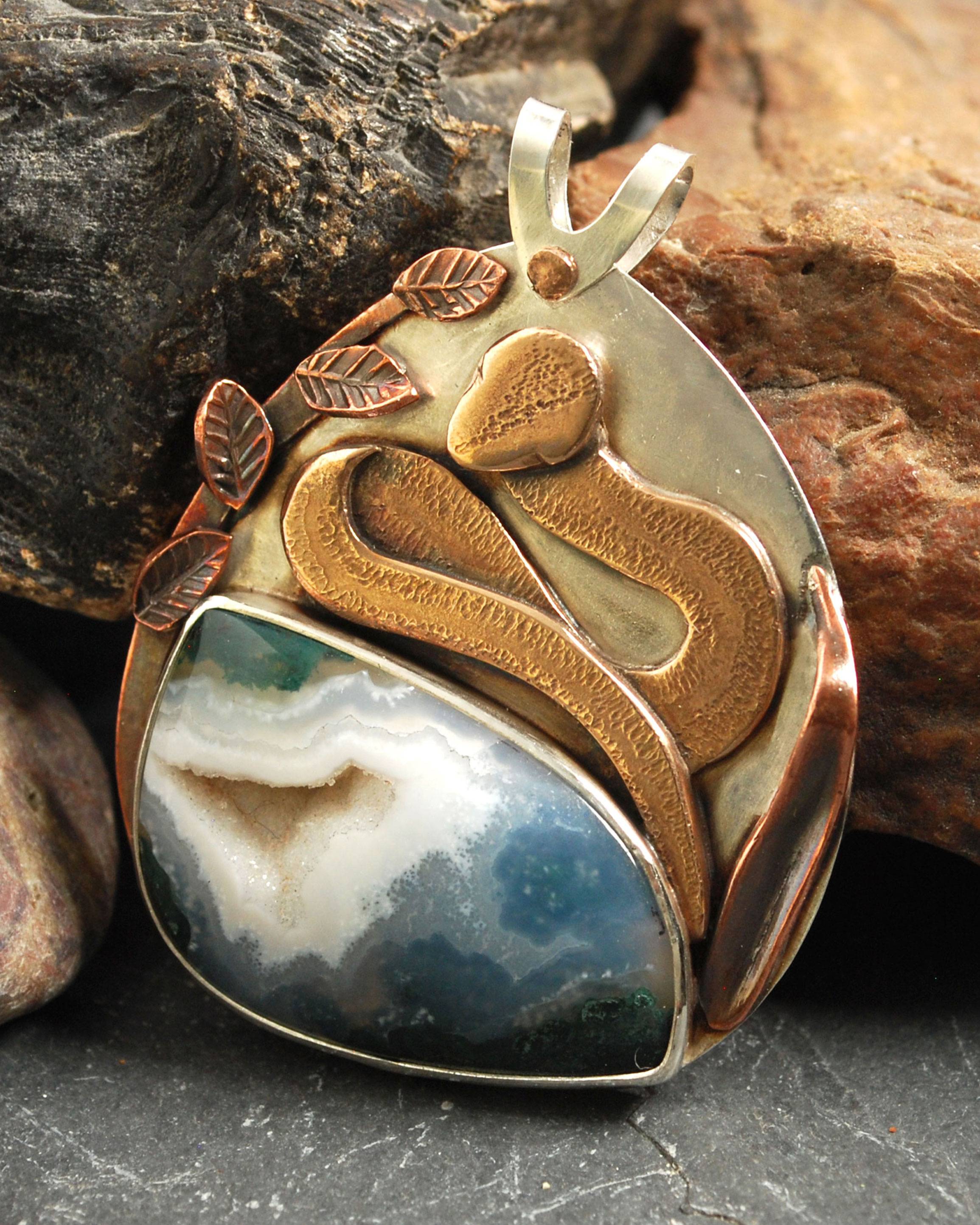 Pendant with agate and bronze snake above stone