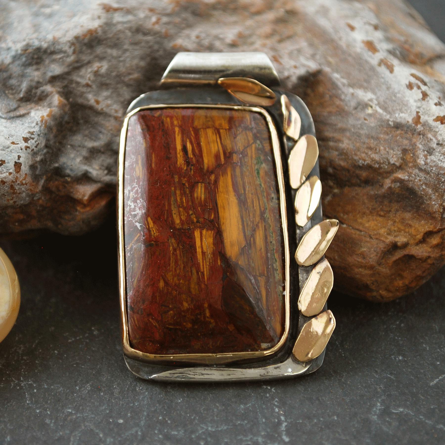 Pietersite pendant with gold leaves on one side