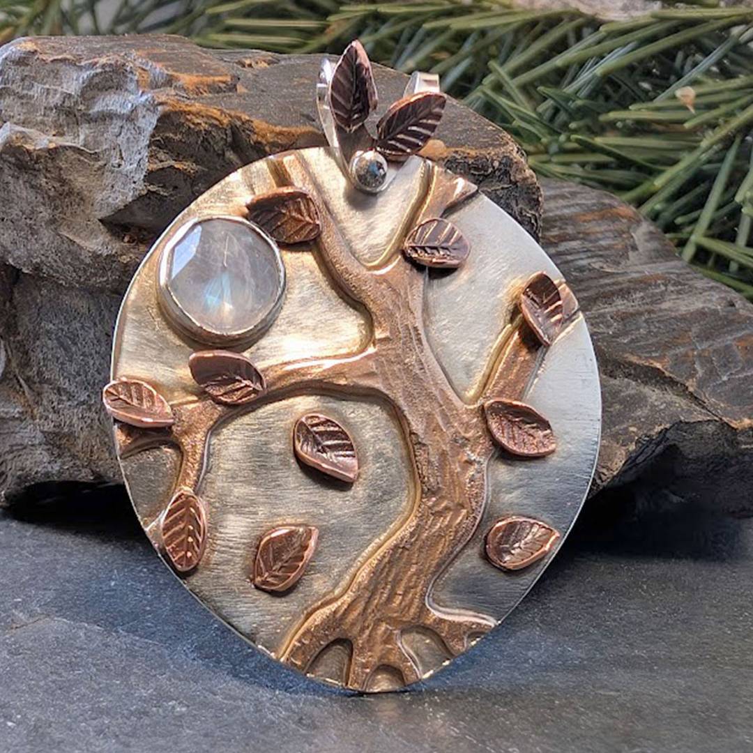 silver pendant with bronze tree, copper leaves, moonstone