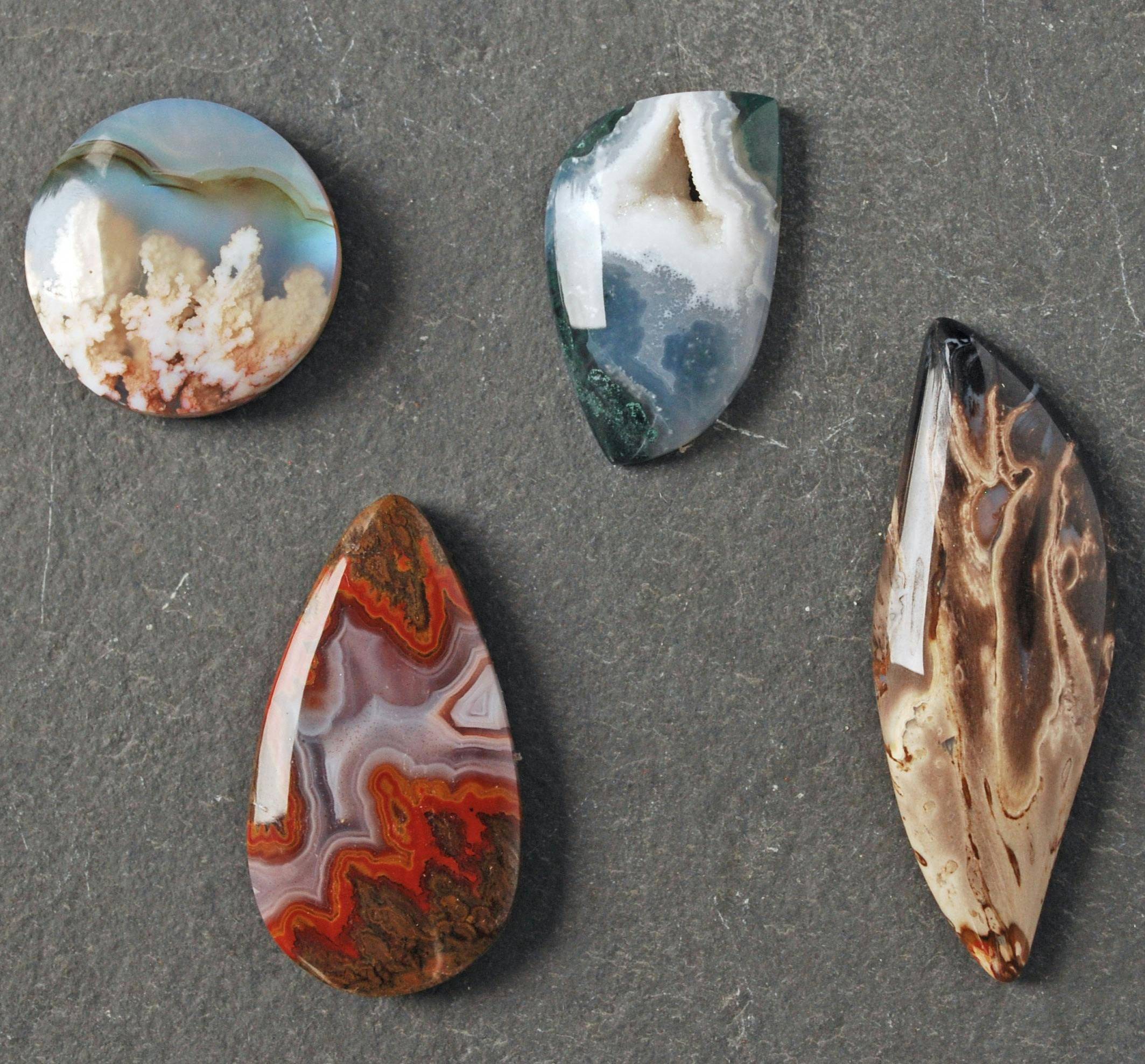 Four cabochons: agate doublet, agate with druzy, Moroccan seam agate, fossilized palm heart