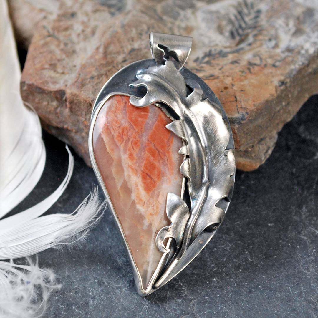 silver pendant with flamingo agate and silver feather