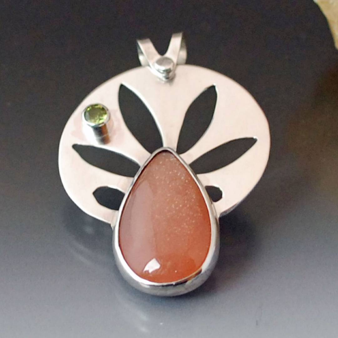 silver pendant with sunstone and peridot