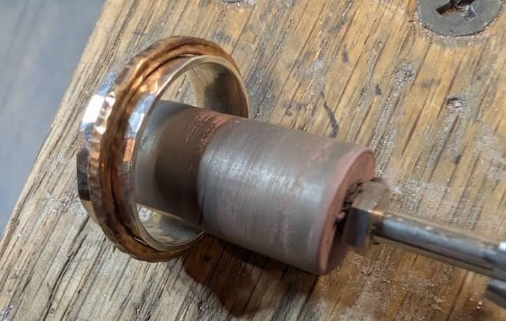 Cylinder silicon wheel being used to polish inside a ring