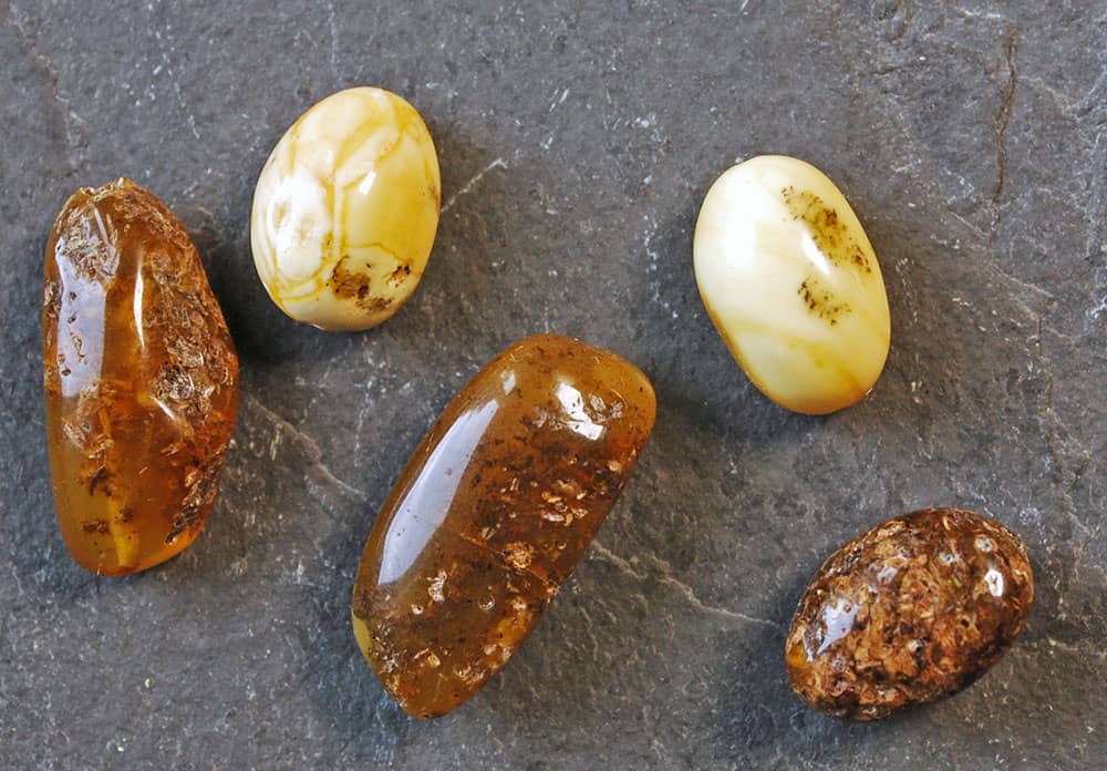 Five natural amber beads