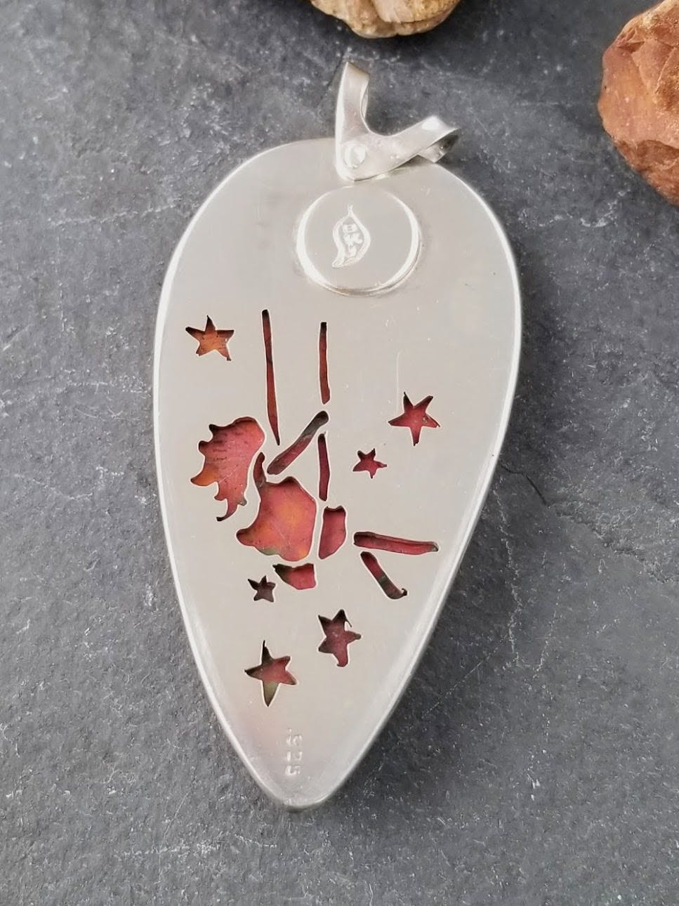 Pendant back with girl on swing cut out