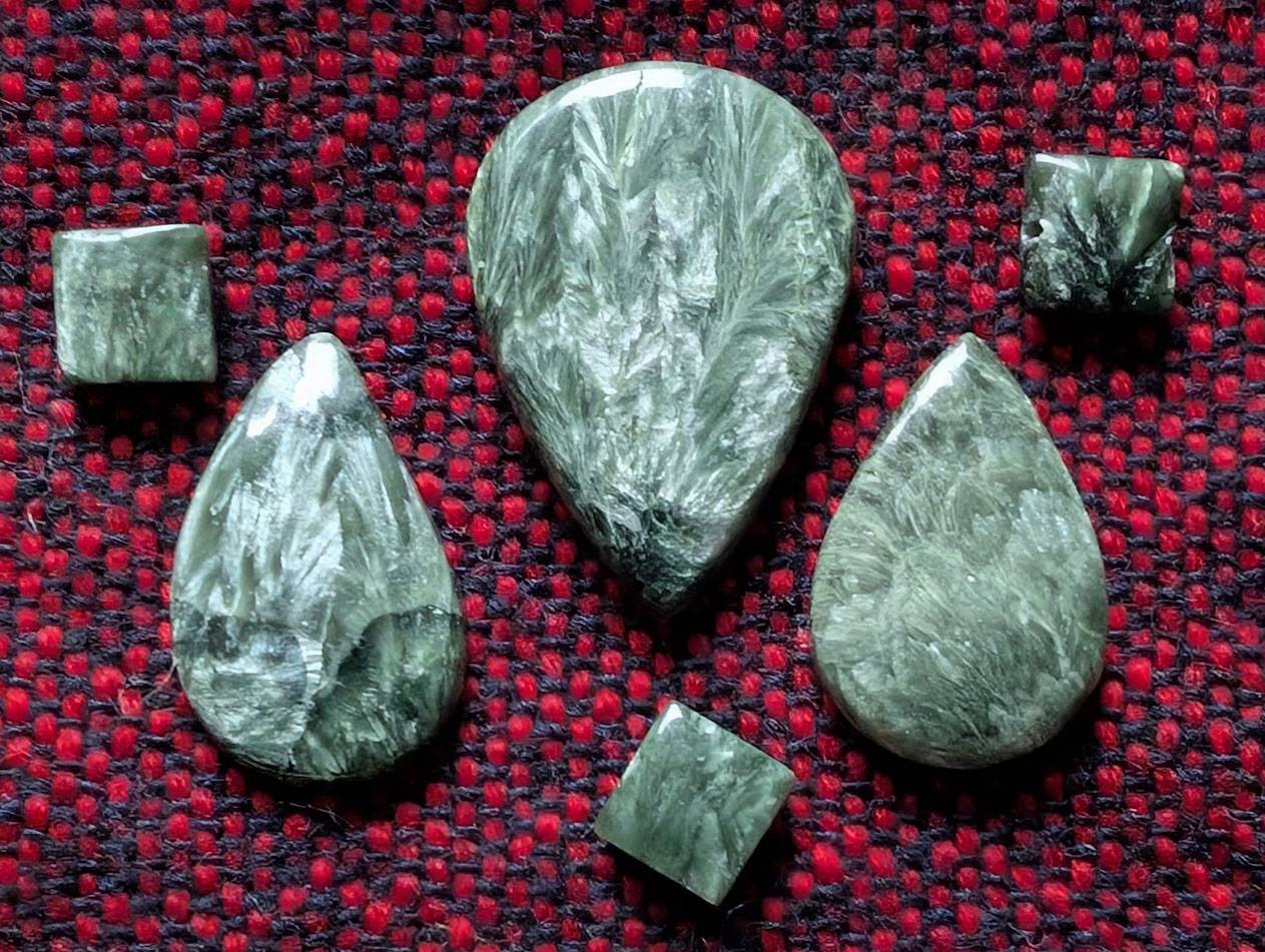 Group of seraphinite cabochons and beads