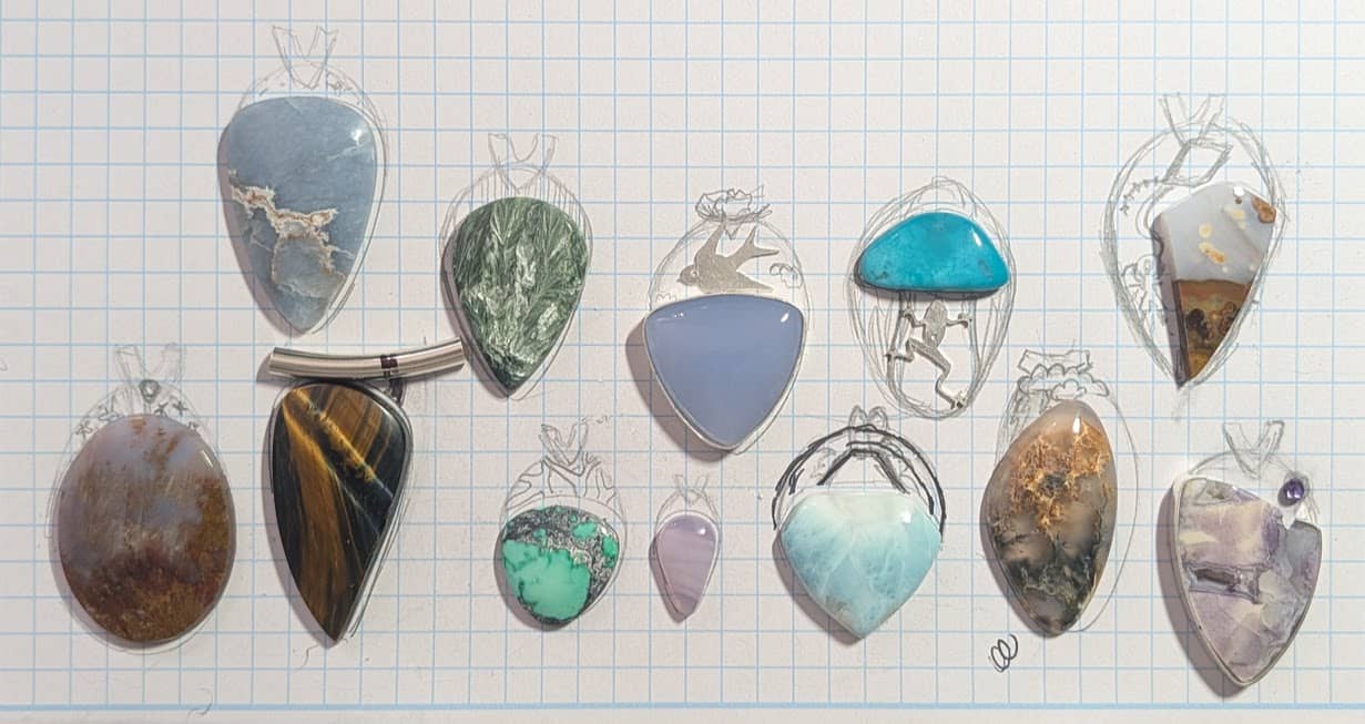 Group of stones with pendant design sketches around each one.