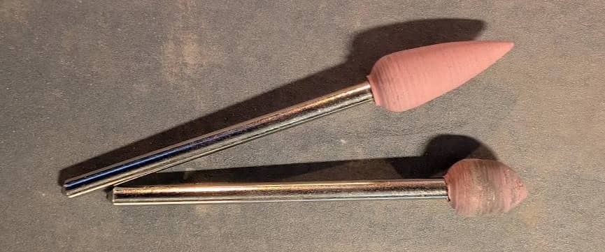 Two silicon point attachments: one new and one worn down