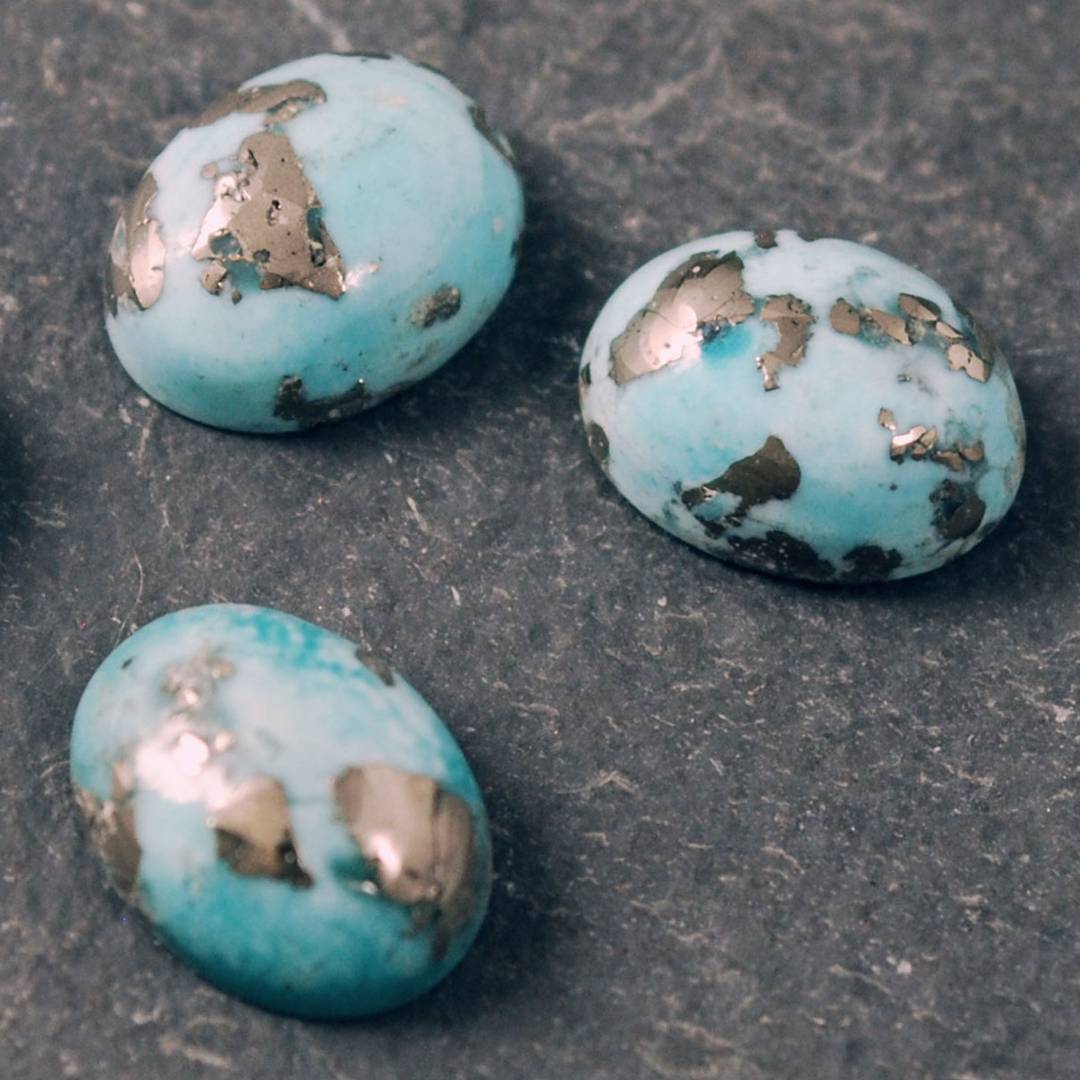 small turquoise cabochons with pyrite flecks