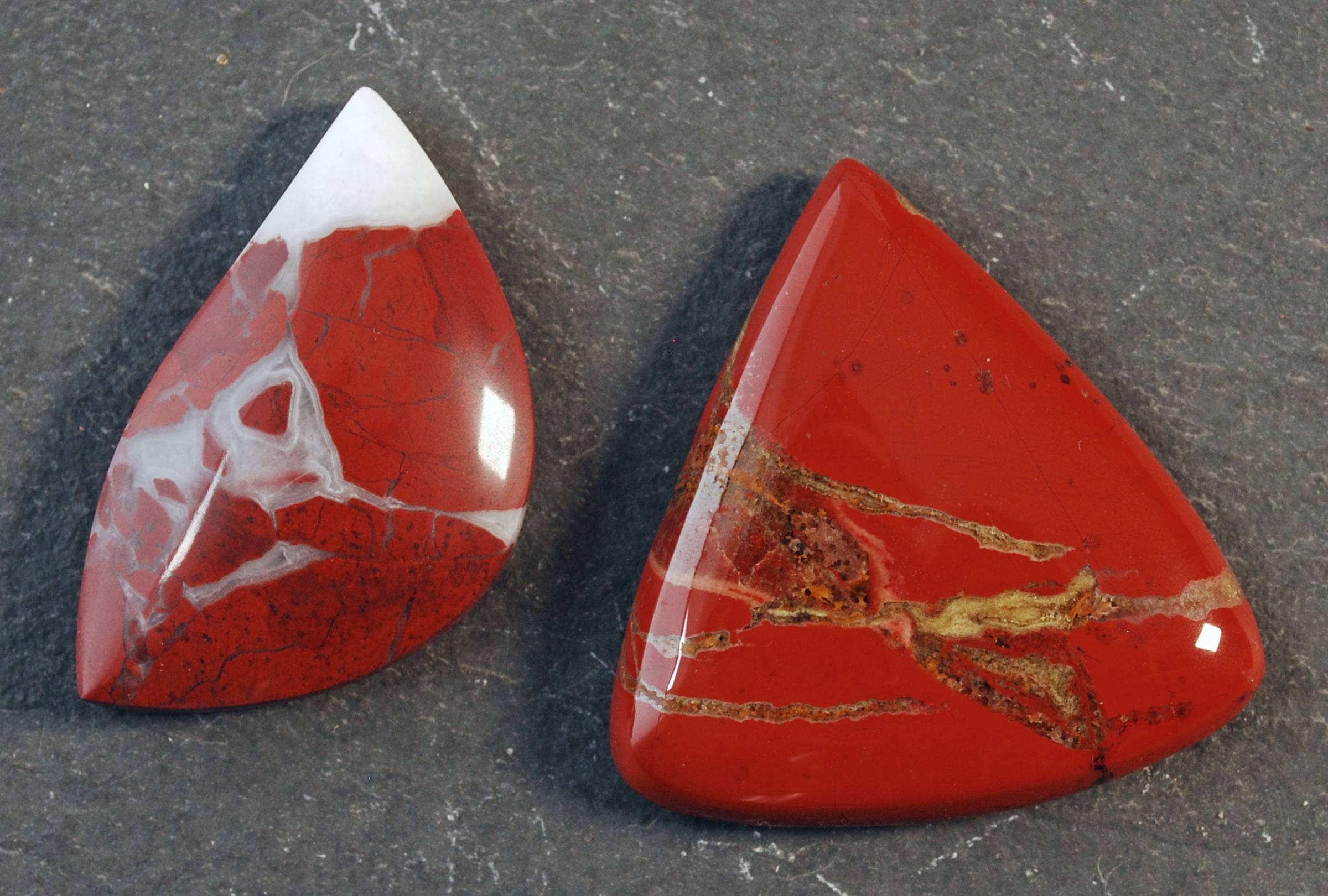 Two red jasper cabochons