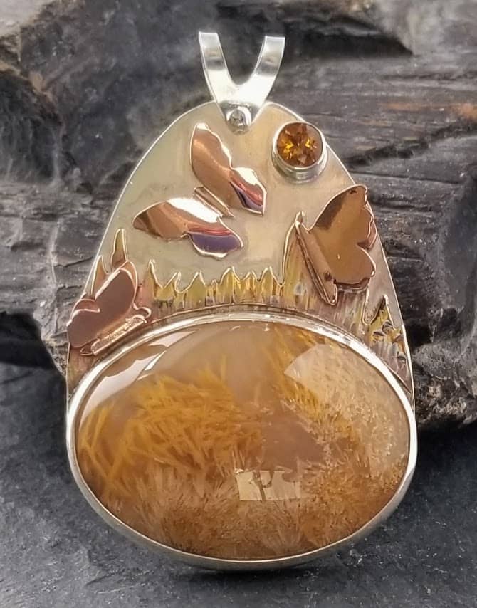 Sagenite pendant on silver with brass butterflies