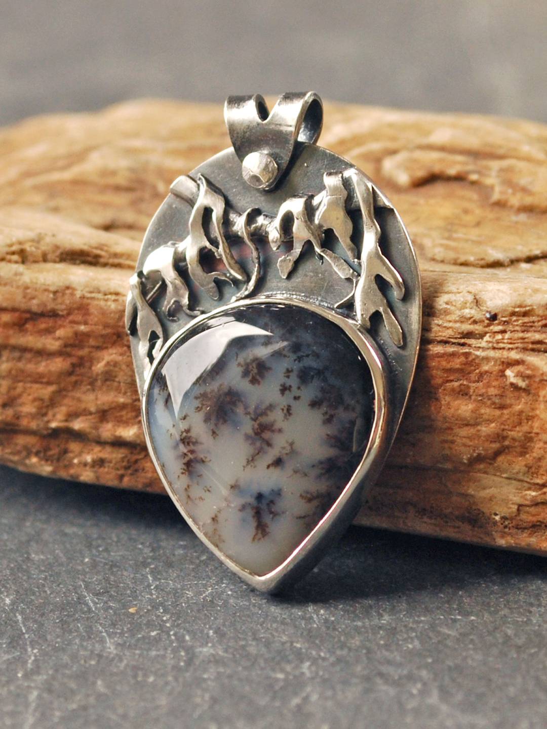 Silver pendant with dendritic opal
