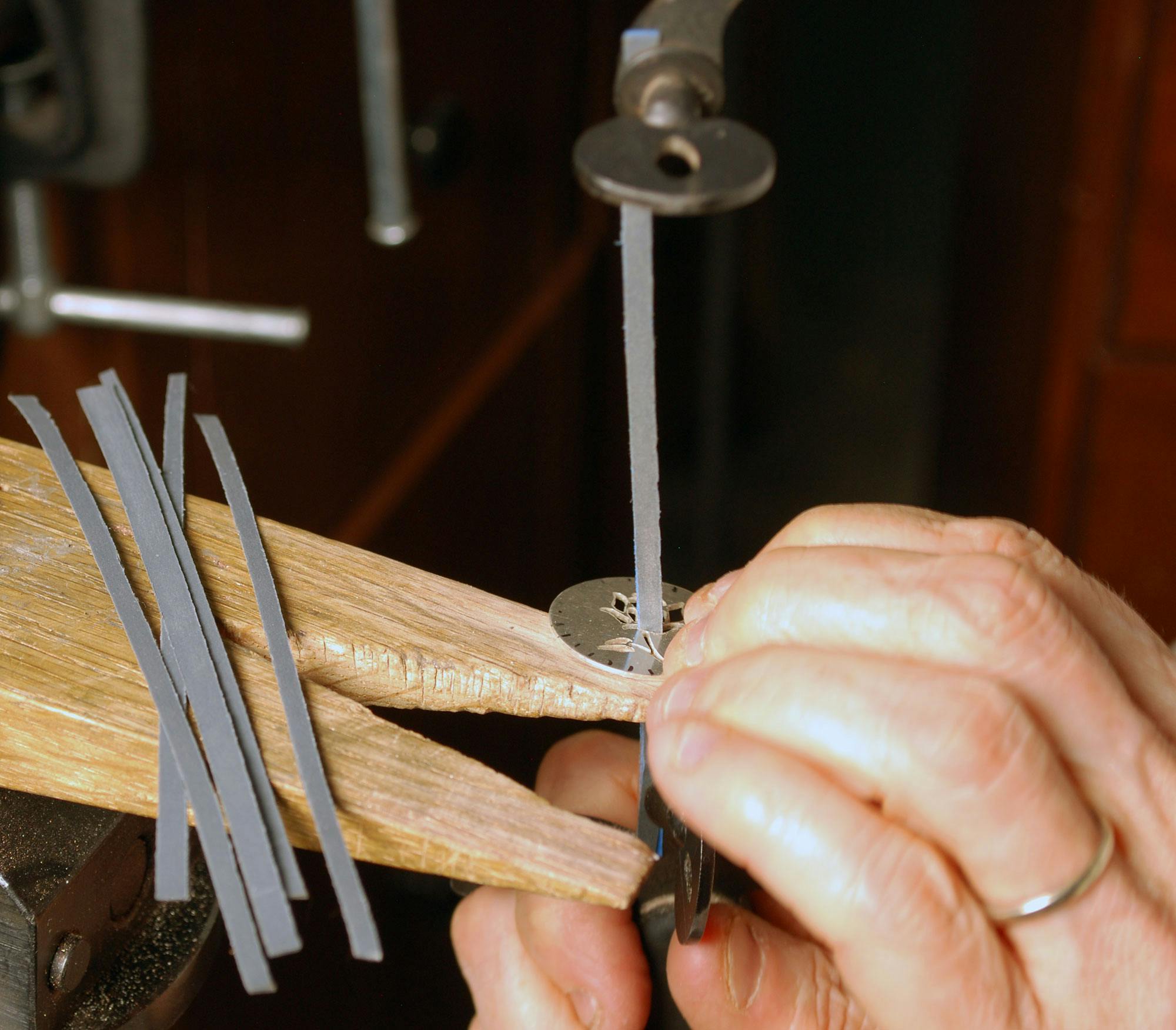 Using sanding strips in jeweler's saw to sand inside cut-outs