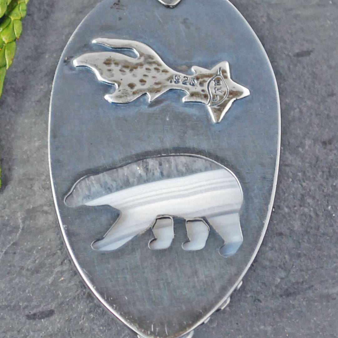 Back of pendant showing polar bear cut out