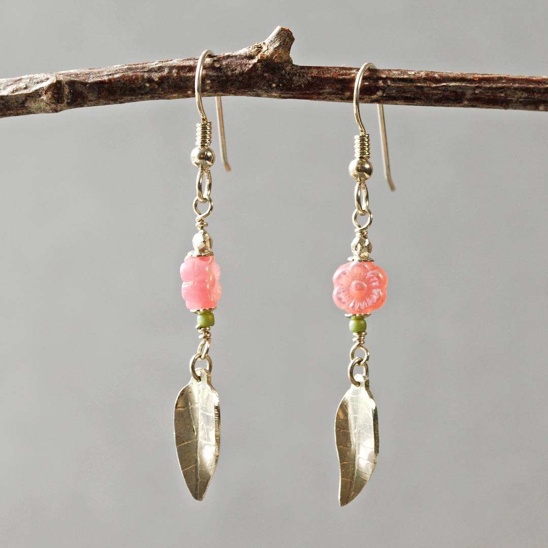 silver earrings with pink flower beads and silver leaves at the bottom