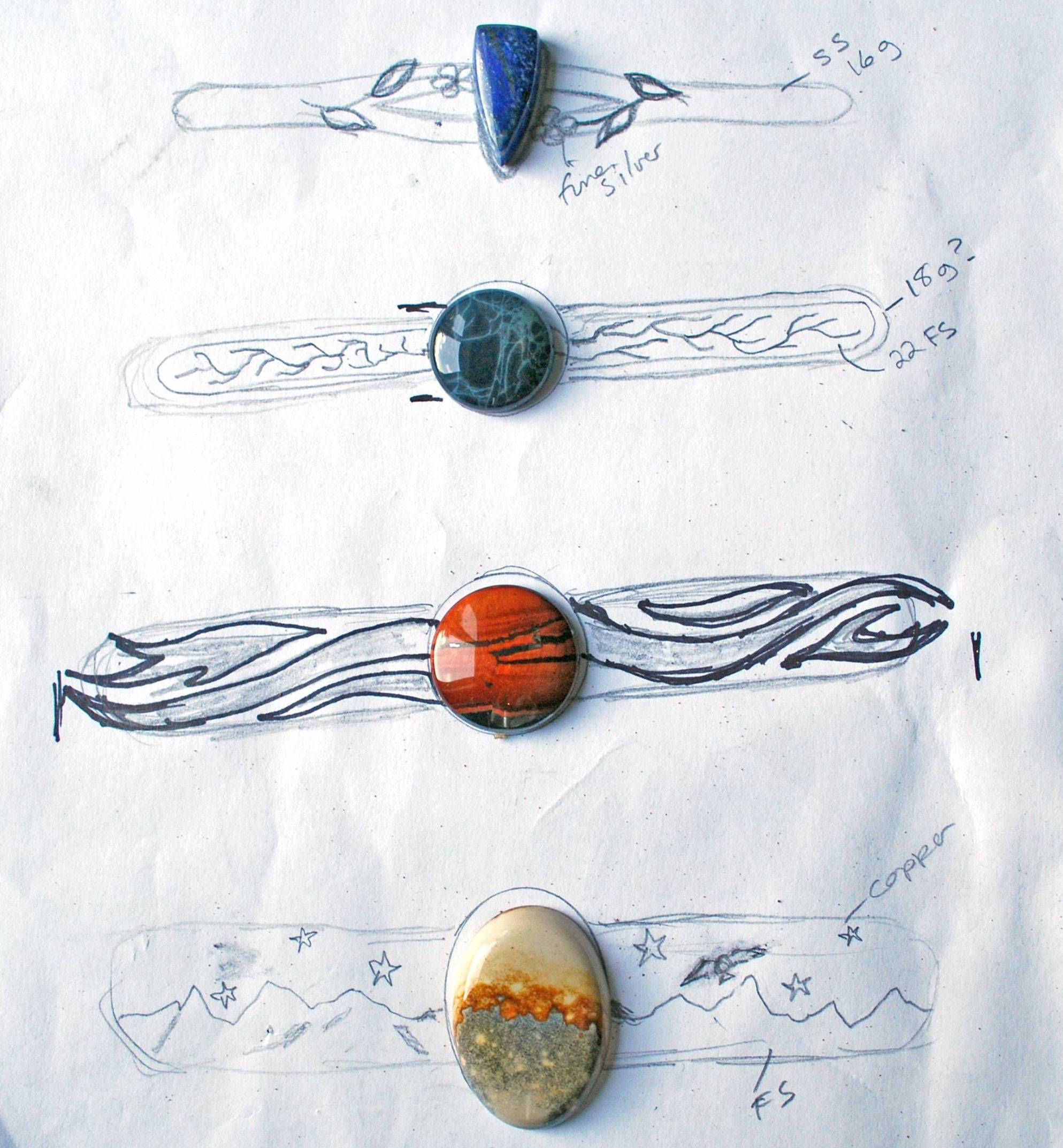 Four cuff designs with stones. Top lapis stone with flowers on cuff; spiderweb obsidian with fine line decor on cuff; tiger's eye with flowing line decor; McDermitt jasper with mountains and stars on cuff