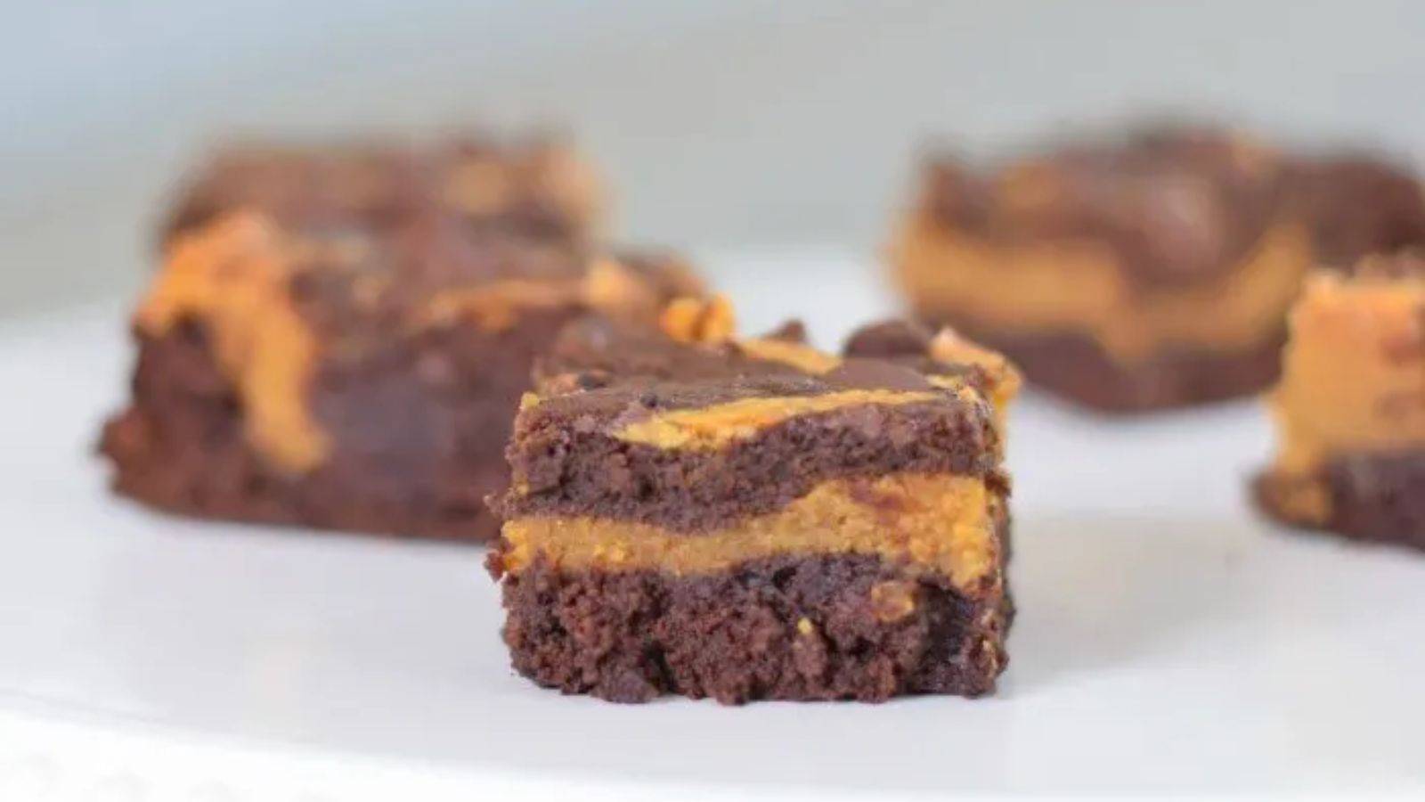 A plate of pumpkin swirl brownies.