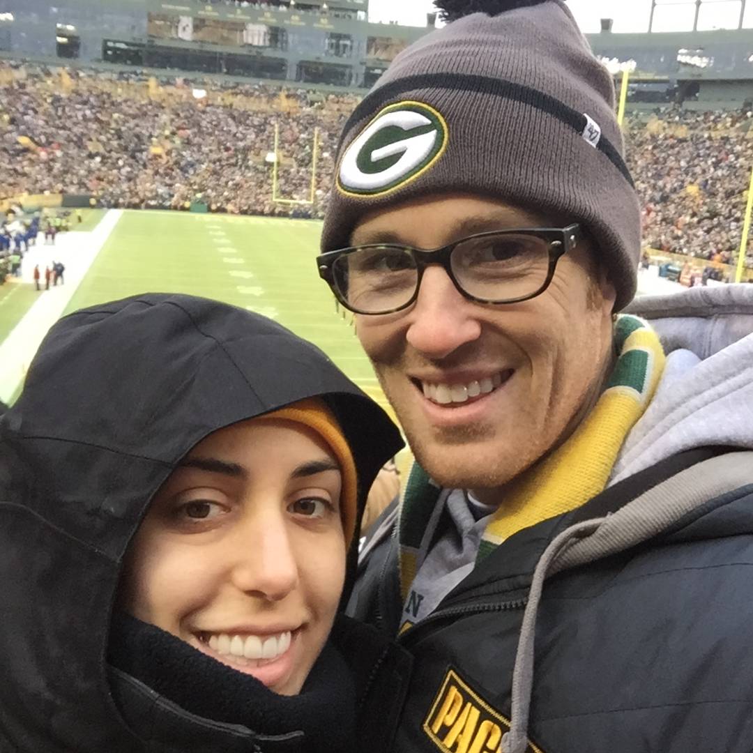 sam and her husband ryan outside in the cold at Lambeau Field in Green Bay wisconsin