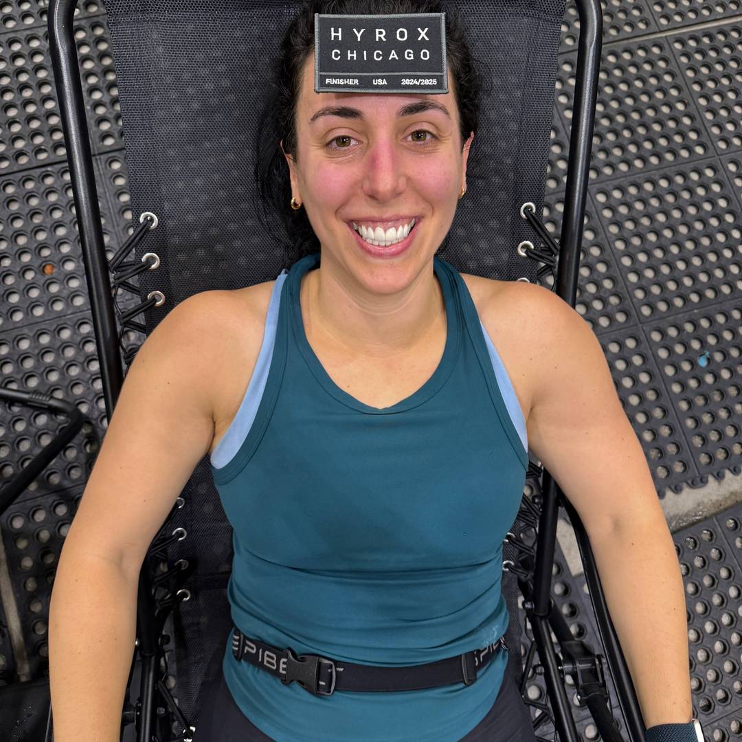 sam laying in a chair after competing in hyrox chicago