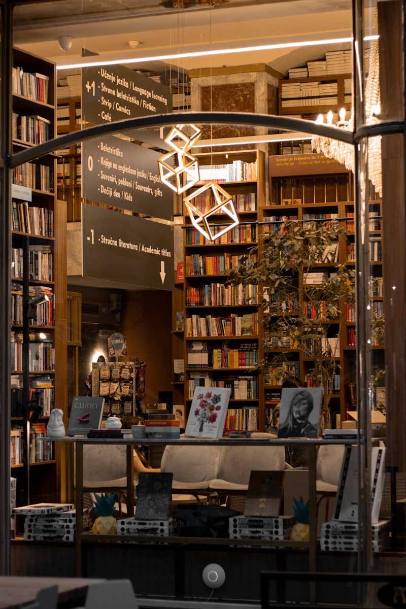 a library filled with lots of books and furniture