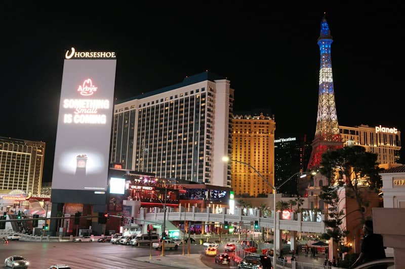 Vibrant cityscape with illuminated buildings at night