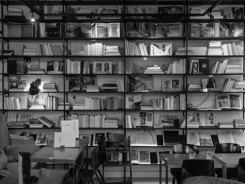 A bookshelf is filled with books and decorations.