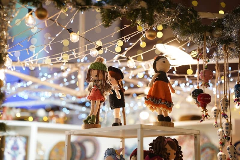 A christmas display with ornaments and lights in the background