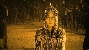 Sepia-toned photo taken from the 1924 film by Fritze Lang. This is after Kriemhilde becomes Queen of the Huns. 
