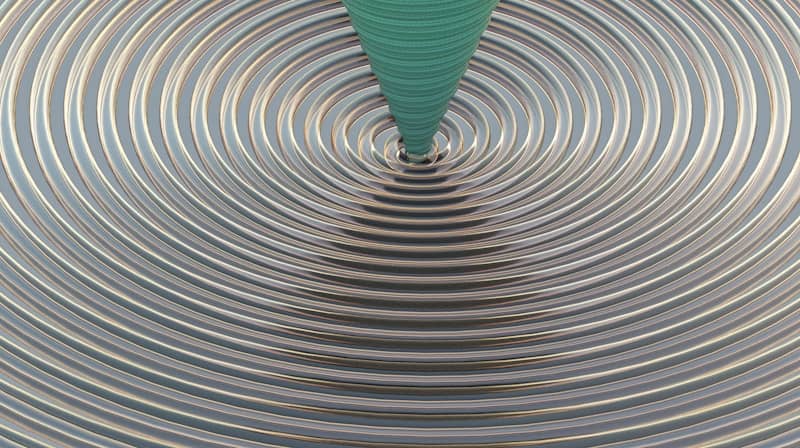 Concentric circles with a green cone in the center.
