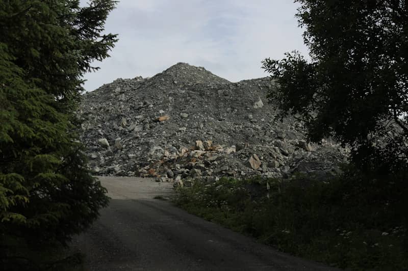A large pile of rocks with trees framing the view.