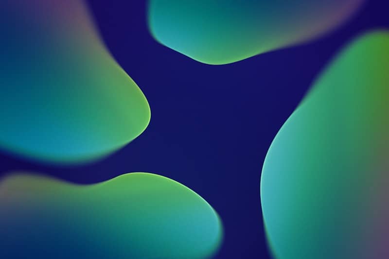 Abstract fluid shapes with vibrant green and blue colors