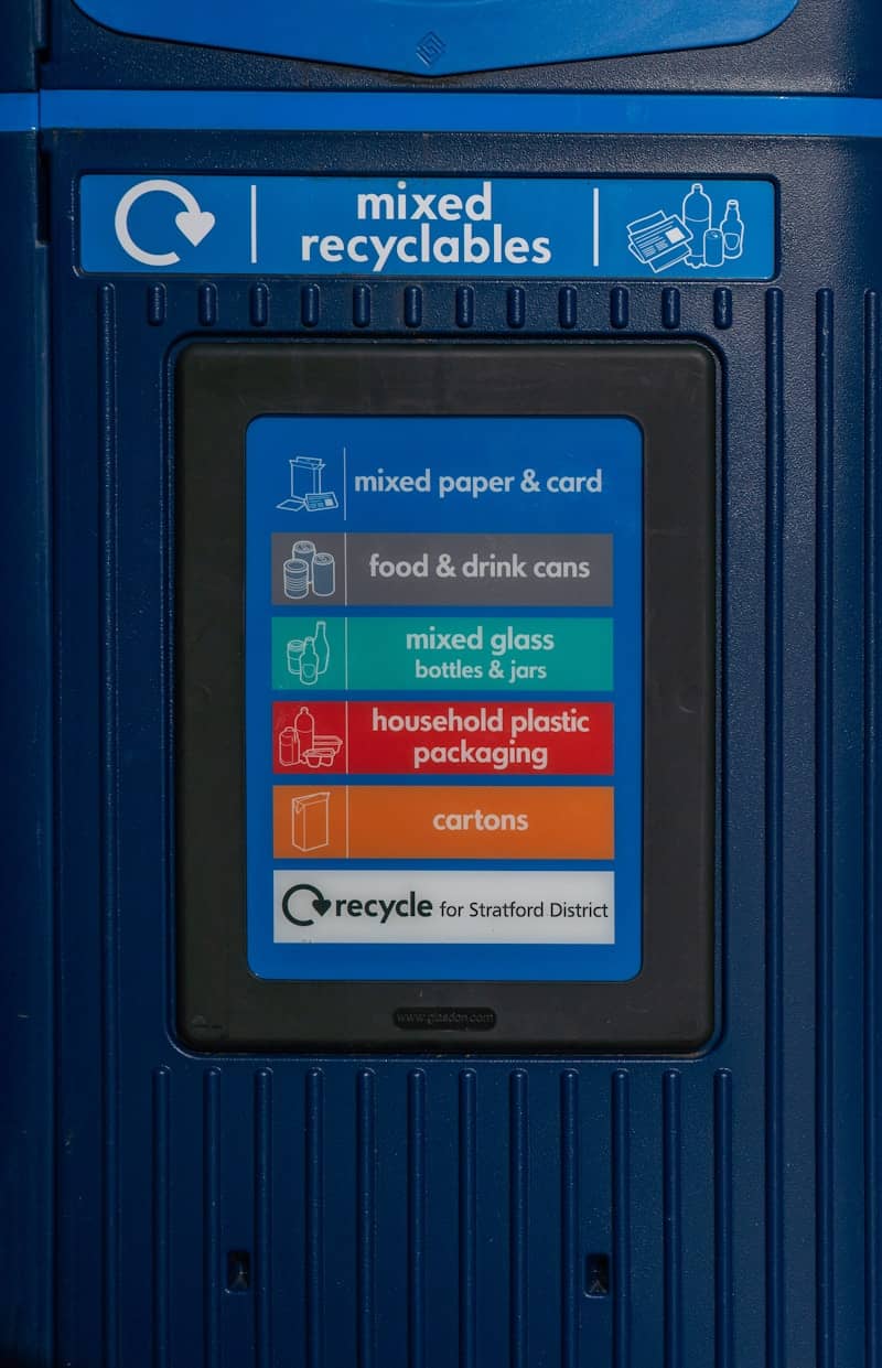 Recycling bin with categories for mixed recyclables.