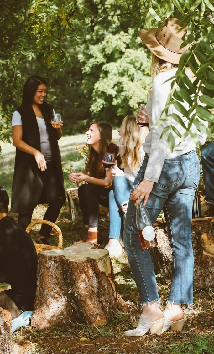 group of women in forest drinking