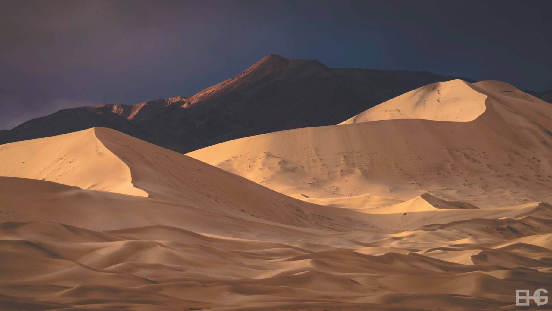 remote dunes with sunset light