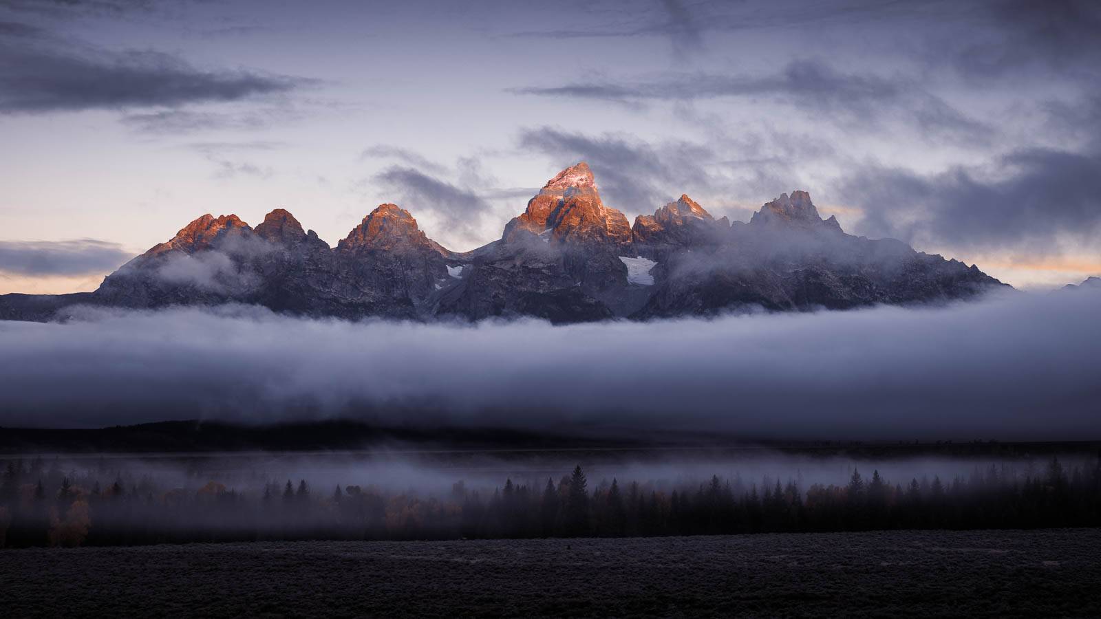 grand teton mountains in fog