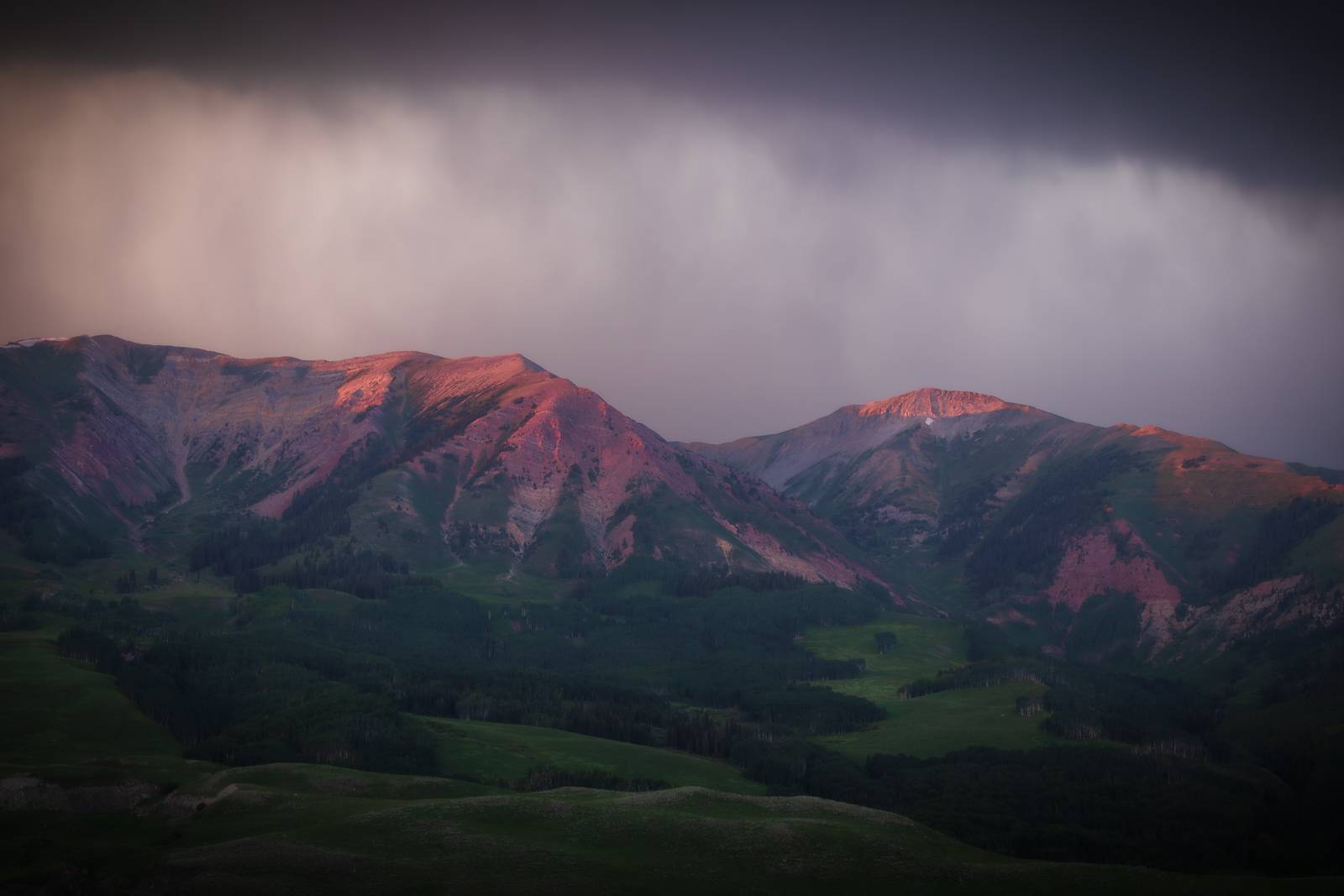 storm clouds lit mountains