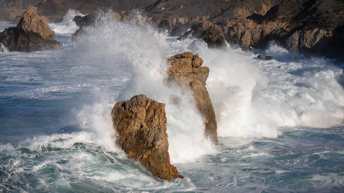 waves crashing on rocks with fast exposure