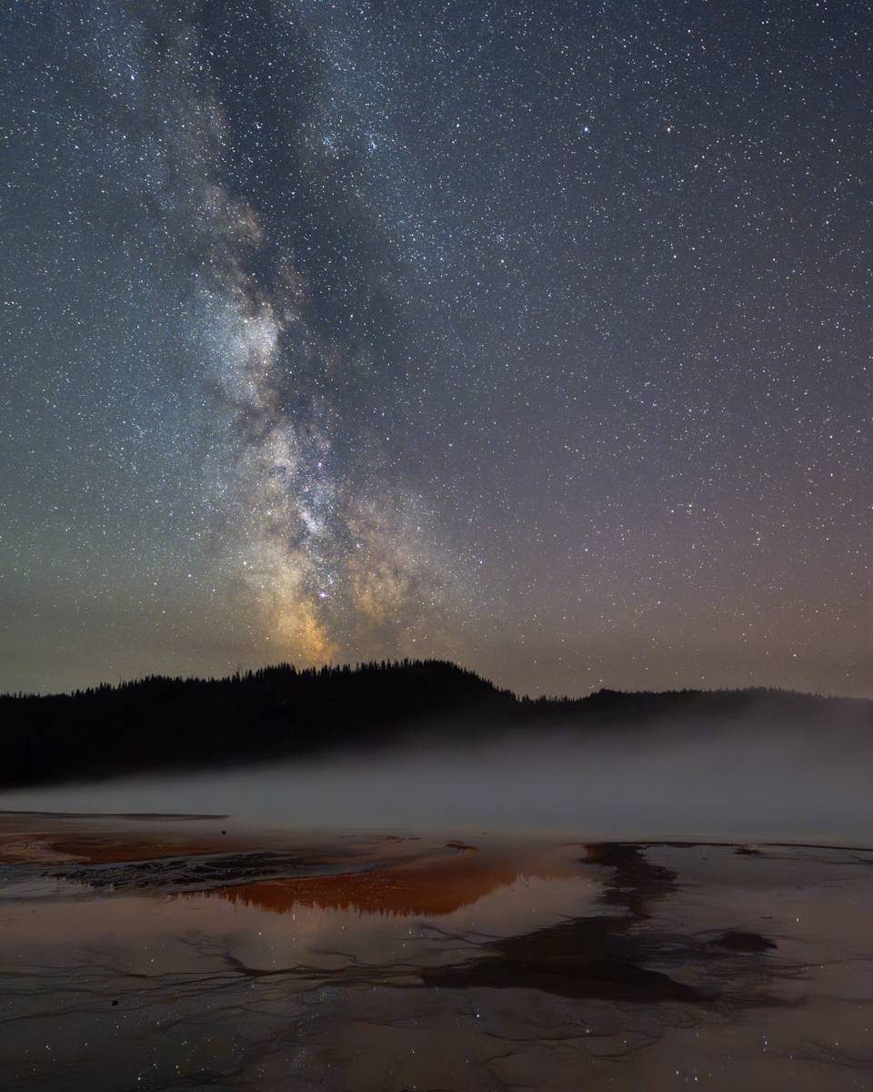 milky way over grand prismatic in yellowstonee