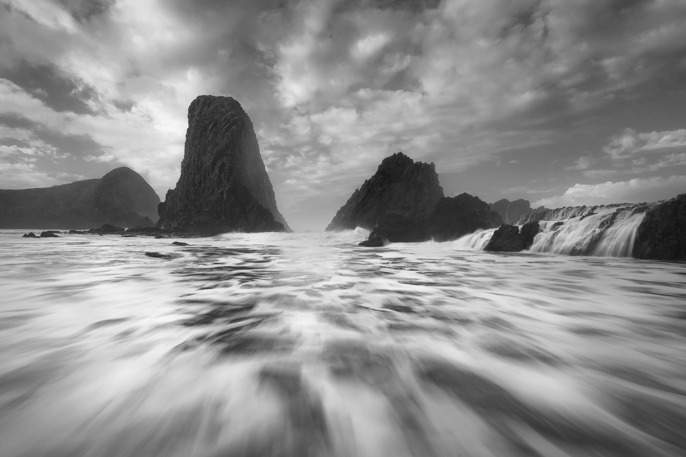 sea stacks with flowing waves