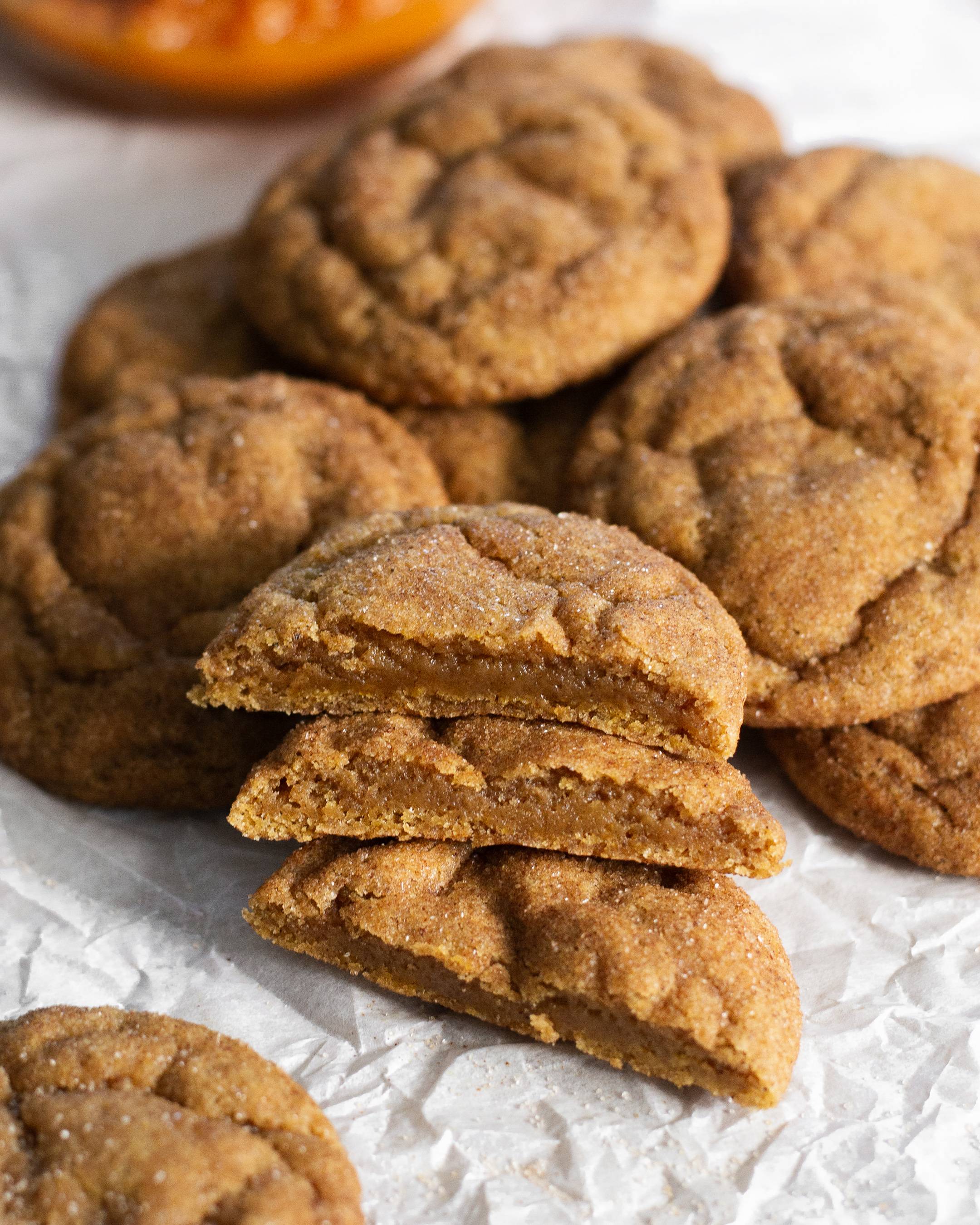 Soft and cozy pumpkin spice snickerdoodles made with your favorite pumpkin spice blend, 100% pumpkin purée, and rolled in cinnamon sugar.