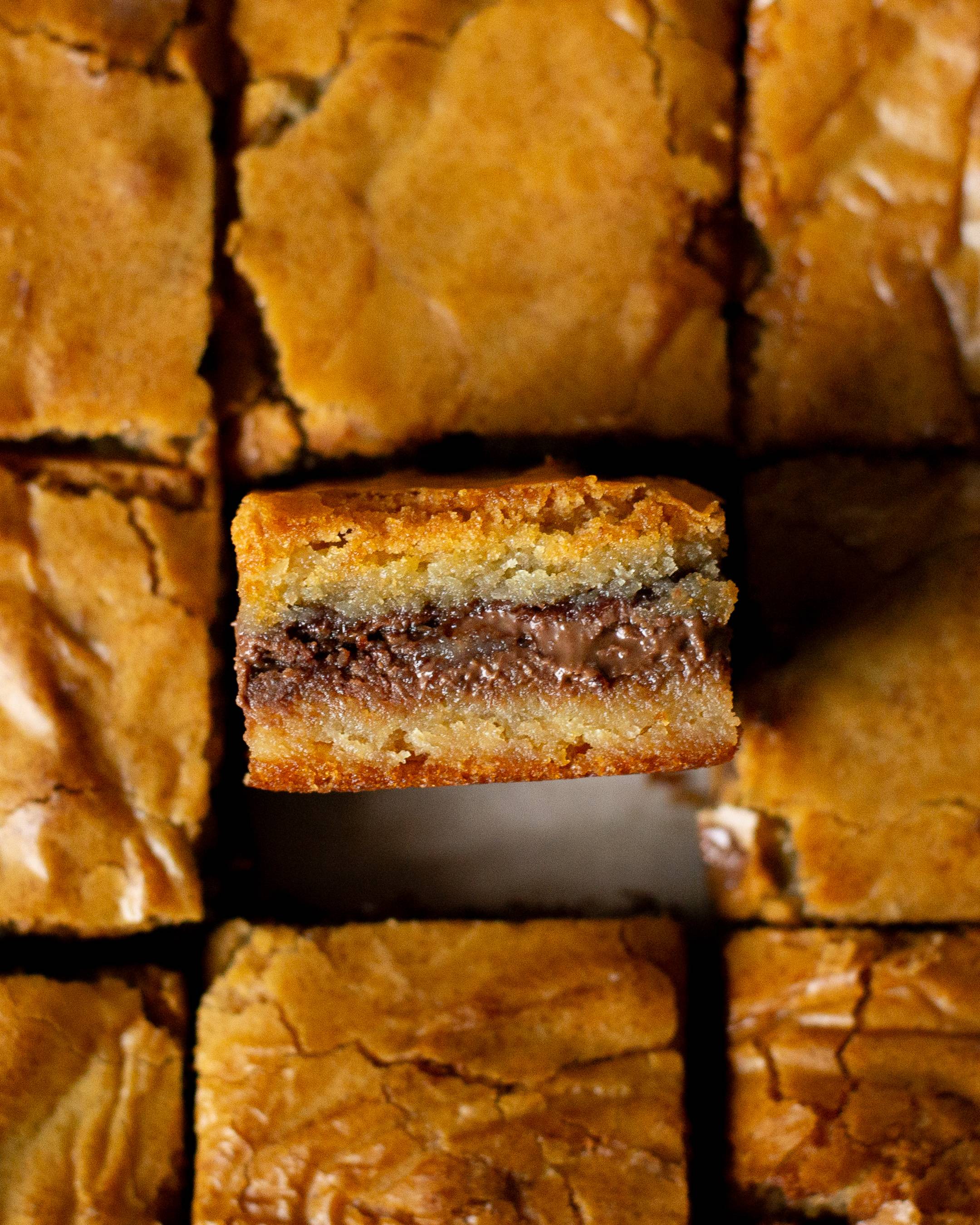 A rich and gooey layer of Nutella sandwiched between layers of white chocolate blondie batter.