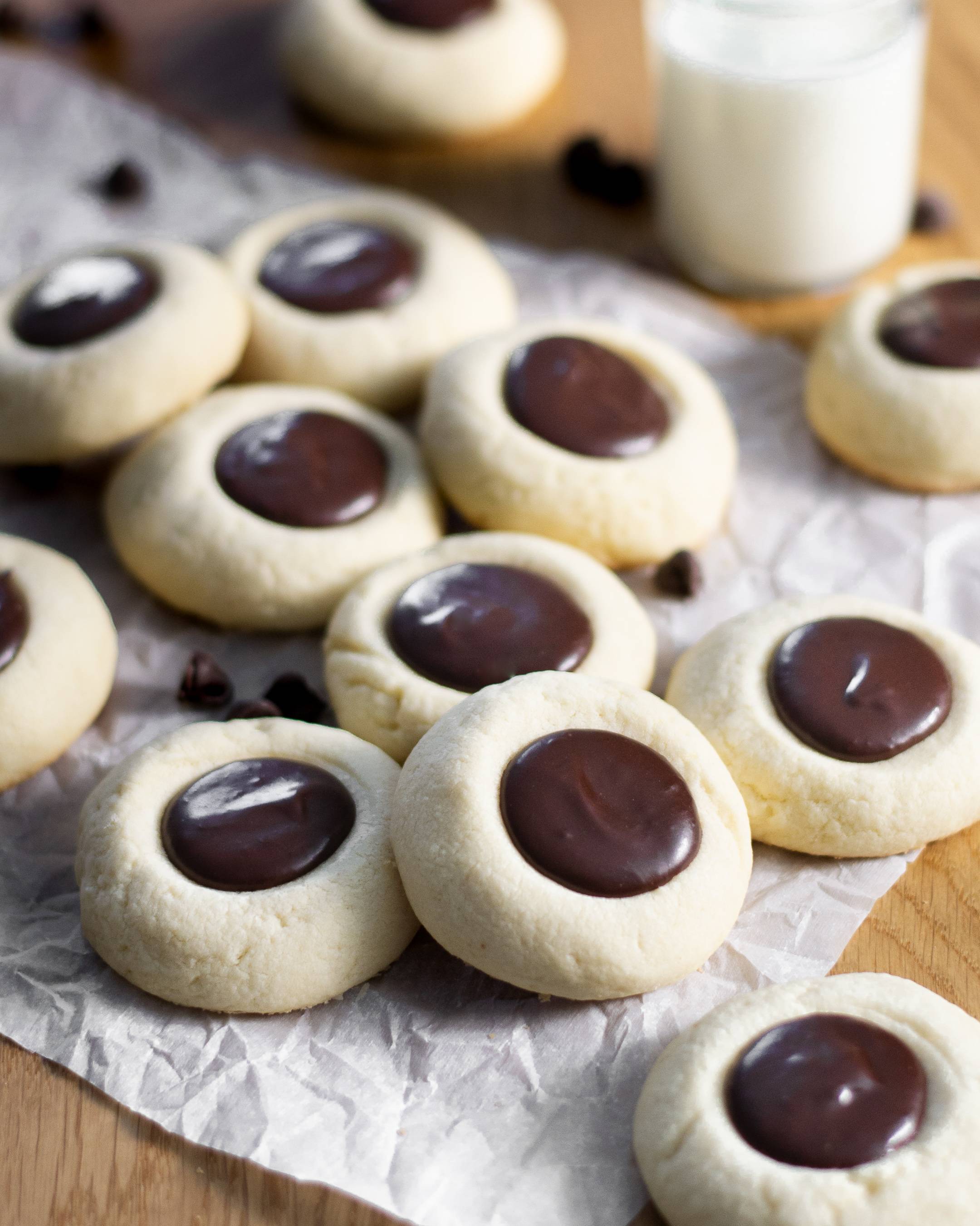 Buttery and tender vanilla thumbprint cookies filled with an easy and silky semi-sweet chocolate ganache.