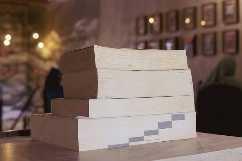 A stack of books sitting on top of a table