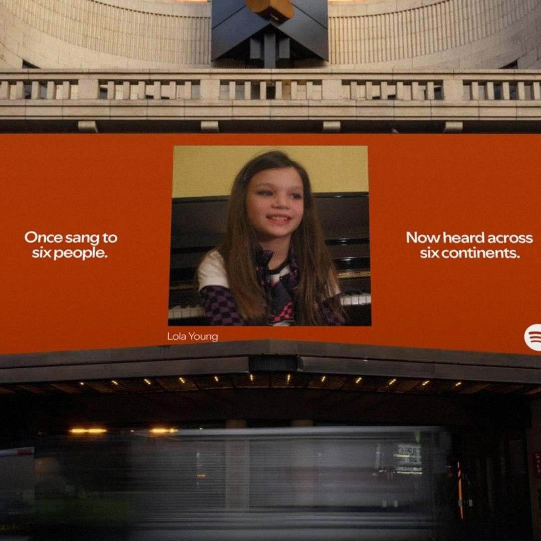 A picture of Lola Young as a child as part of a Spotify billboard ad