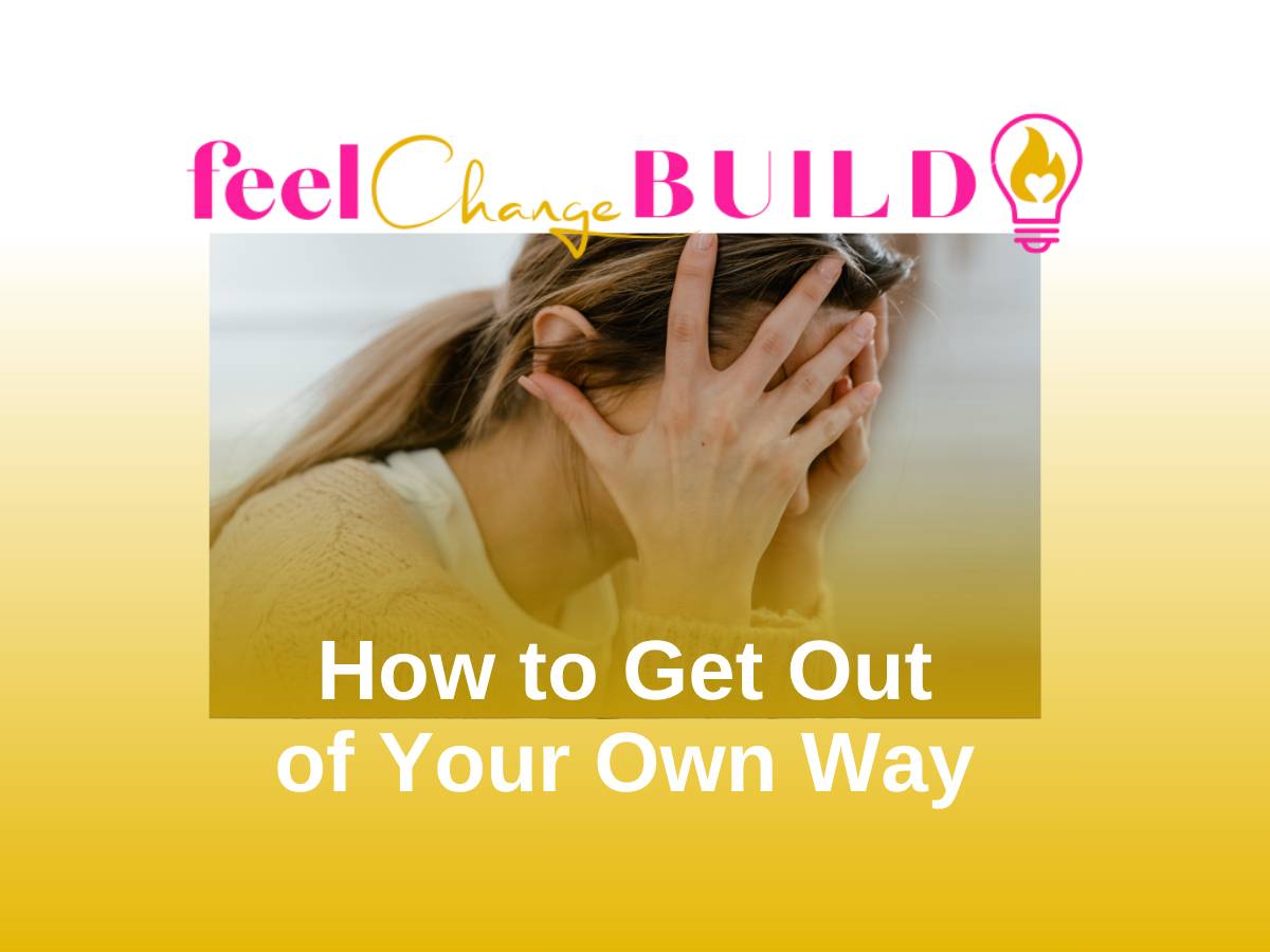 Woman holding head in hands