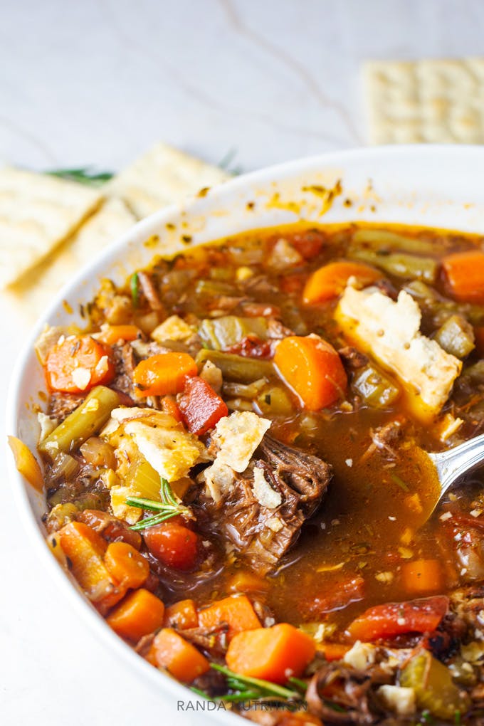 pot roast soup in a bowl with crackers