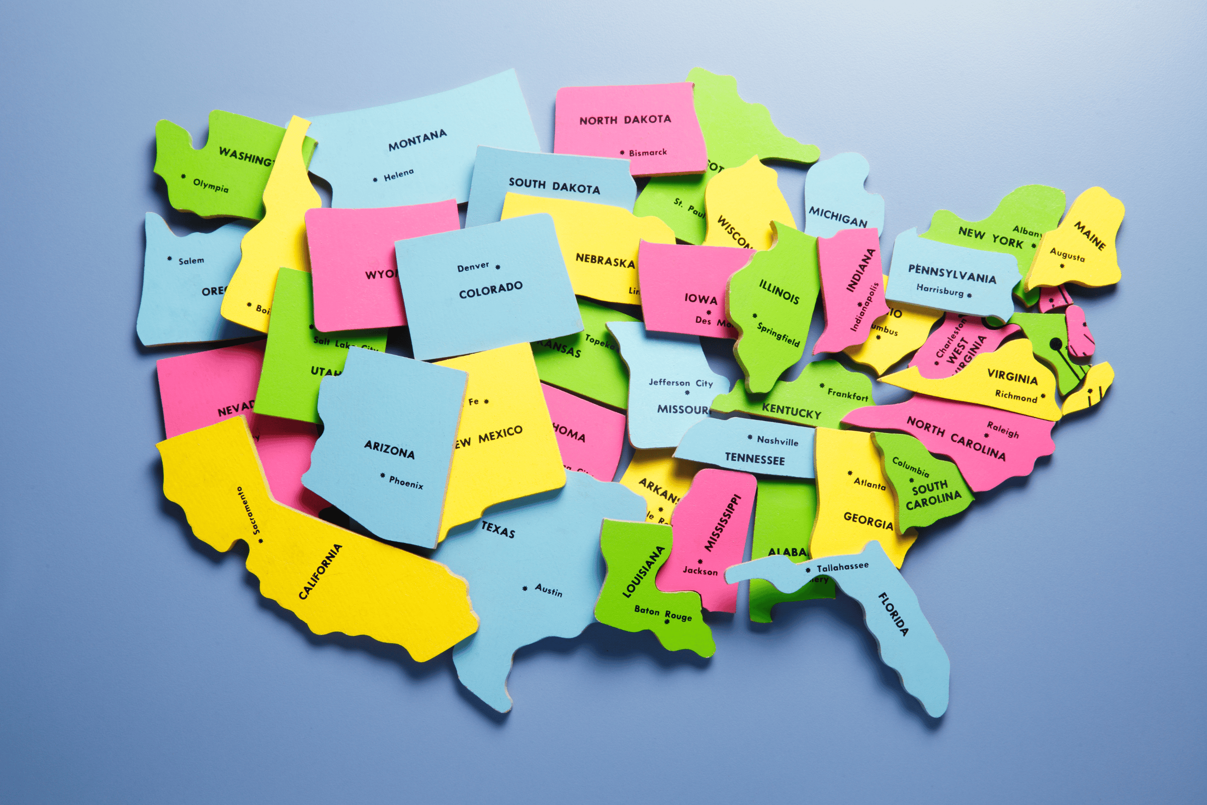 The image shows a jumbled map of the US states. The image conveys Top 5 Most Landlord Friendly States to Invest In 2025.
